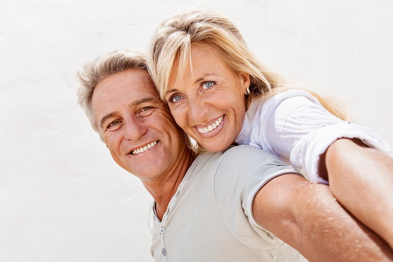 couple smiling with teeth showing