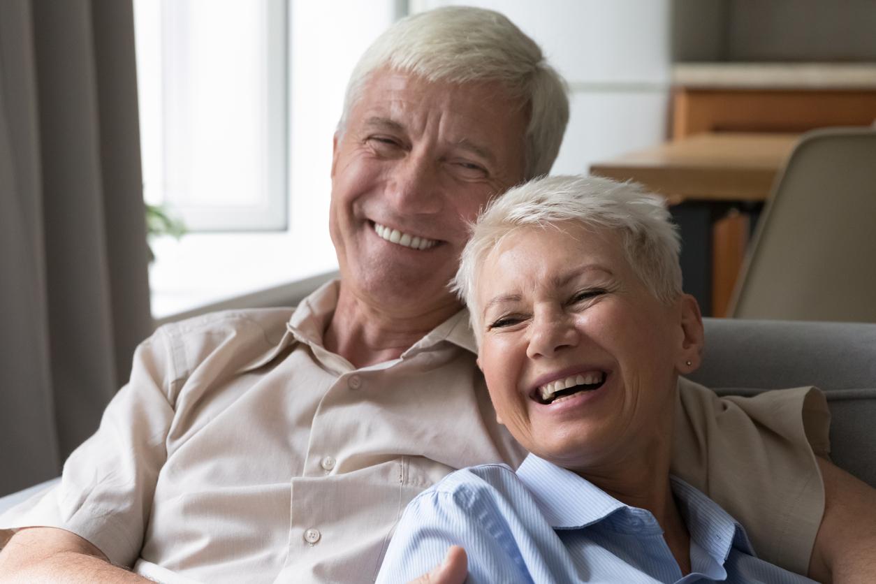 couple with dentures smiling