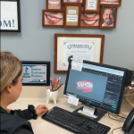 Dr. Claudia Piccolo D.D.S. looking at 3D rendering of patients mouth