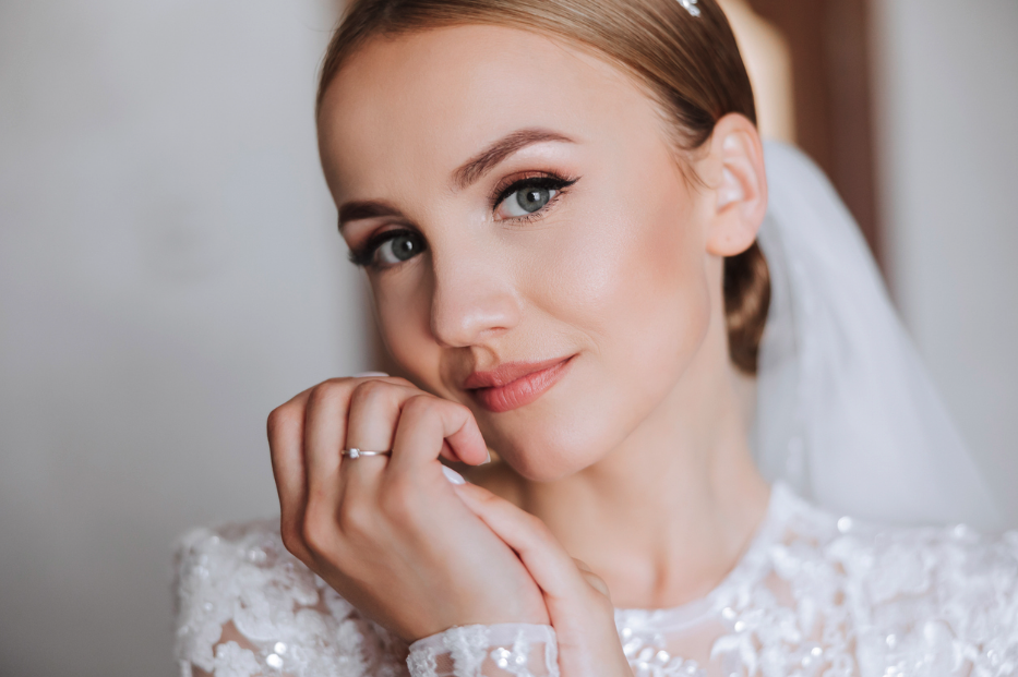 Bride in dress and veil with glowing skin from skin treatments
